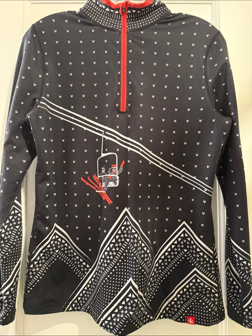 Krimson Klover Black Sweater with White Mountain Pattern and Red Zip